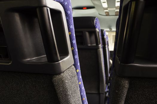 Modern seats for people in a bus, detail of public transportation