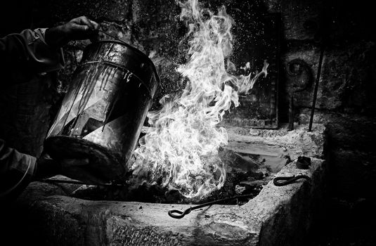 Extinguishing flames with water in the carbon, safety detail