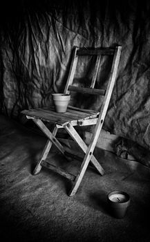 Old wooden village chairs, detail of old furniture in an old basement