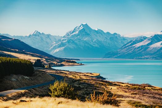 Road to Mt Cook, the highest mountain in New Zealand. Scenic highway drive along Lake Pukaki in Aoraki Mt Cook National Park, South Island of New Zealand.
