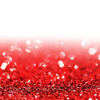 Red twinkling lights abstract holiday background with white copy space