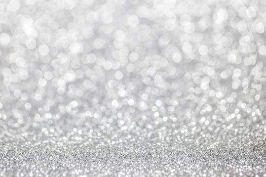 Abstract silver glitter light bokeh holiday party background