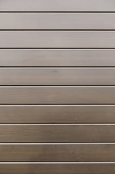Bright Wooden background detail of a wall decorated with wooden boards