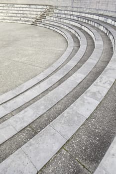 Stone steps in an amphitheater, detail of a spectator bleachers, ancient monument