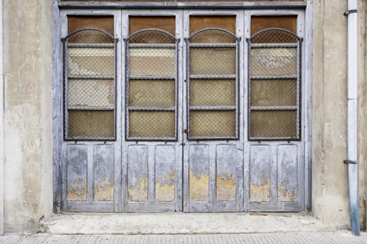 Old abandoned wooden door, detail of wooden doors in the city