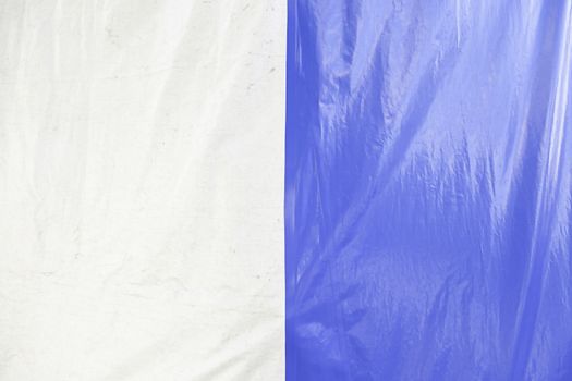 Blue and white canvas, detail of a canvas painted blue and white, and safety protecion