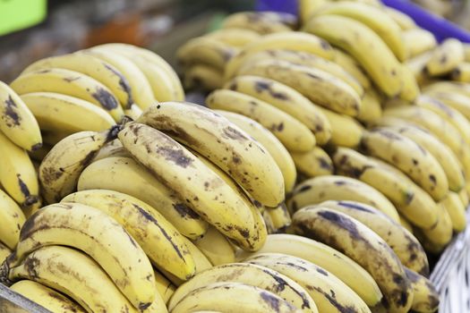 Ripe bananas on a market, detail of a tropical fruit in a shop in town
