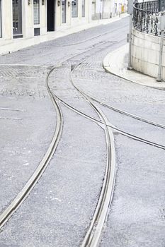 Tram tracks on a street in Lisbon, detail of a route for public transport in the city