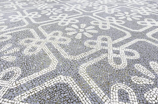 Typical stone floor Lisbon, detail of a typical floor with shapes and drawings, art Portugal, tourism
