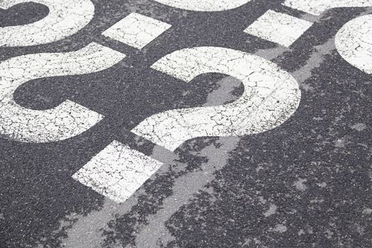 Sign question on asphalt, detailed interrogation signal, information