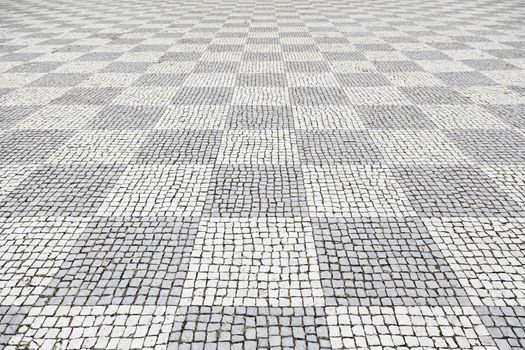 Typical stone floor Lisbon, detail of a typical floor with shapes and drawings, art Portugal, tourism