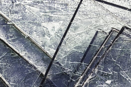 Broken glass, detail of broken plates and glass damaged in the city, dirt and debris