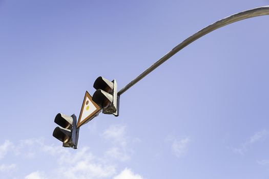Traffic light in the sky, detail of a traffic signal for vehicles, safety and information