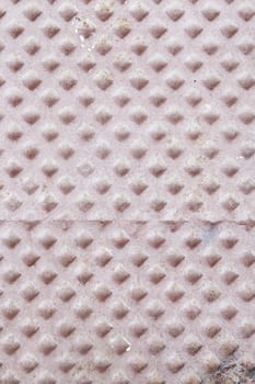 Tile floor in the city, detail of a cement tile, decoration and safety
