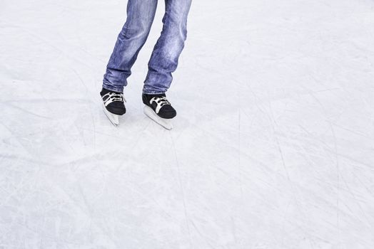 Skating on the ice, skating young person in an ice rink, winter sports, cold and fun