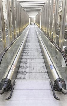 Escalator in the city, detail of stairs to climb a street in the city comfort, modern