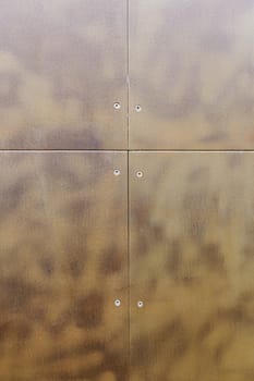 Rusty metallic background, detail of a wall in the city, textured background, urban furnishing