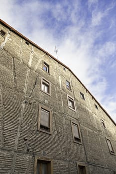 Wall of old house, detail of an old abandoned house in the city, rural architecture