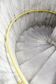 Spiral staircase in the city, detail of modern architecture, urban life