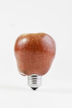 Bulb apple, detail of an electric apple, fruit and sustainable development, environment
