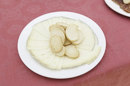 Cheese plate with bread, detail of healthy food, daily food, milk product