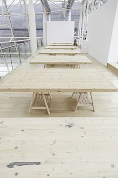 Simple wooden tables, a detail of unpainted wooden tables, support and indoor decoration, furniture
