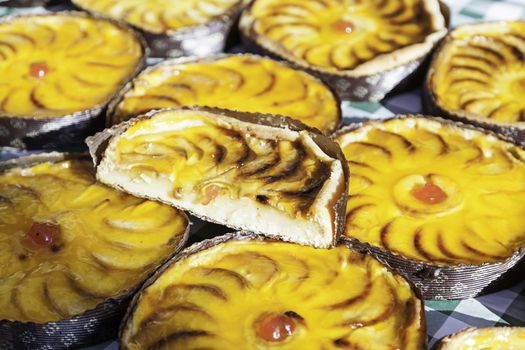 Apple pies in a market, a detail of homemade cakes in a traditional market in the city, baked sweet