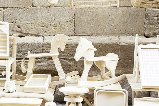 Detail of a wooden horses, woodwork, classic playground