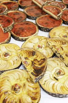 Apple pies in a market, a detail of homemade cakes in a traditional market in the city, baked sweet