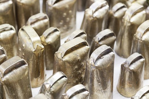 Metal cow bells, detail of some instruments to produce sounds, Local handicrafts