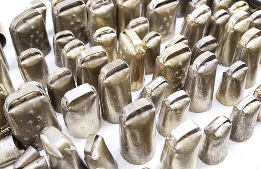 Metal cow bells, detail of some instruments to produce sounds, Local handicrafts