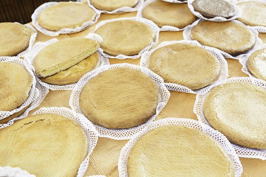 Typical Spanish cream homemade pie, a sweet dessert detail of artisan food in a street market