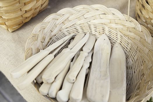Forks and spoons, detail of wooden kitchen utensils, handmade product