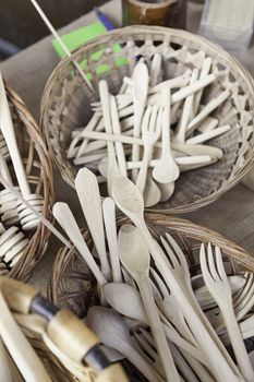 Forks and spoons, detail of wooden kitchen utensils, handmade product