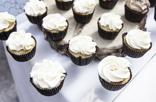 Sweet cupcakes decorated dessert detail flavors, colors and decoration, party and celebration