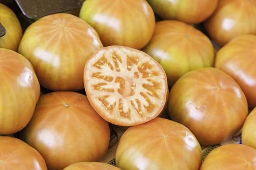 Fresh tomatoes in a market, detail of red vegetables, healthy lifestyle food, vitamins