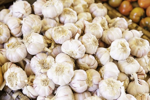 Dried garlic on a market, detail of a raw vegetable in a shop on the street, healthy food, diet