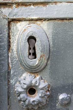 Old rusty lock, detail of an old abandoned city, textured background, rust and mold door