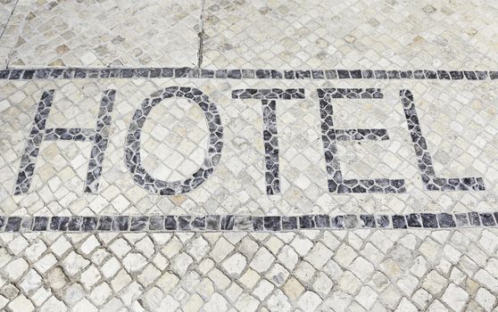 Hotel sign on floor, detail of an information signal at the entrance of a hotel