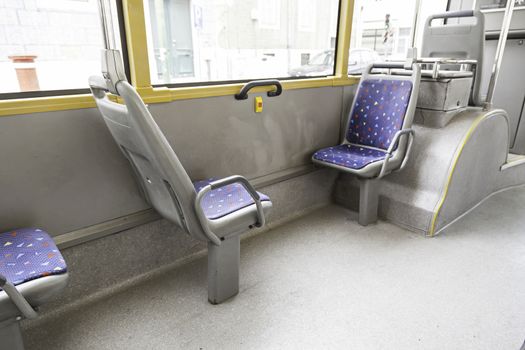 Seating inside a tram, detail of a public transport in the city