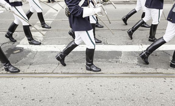 Legs in a military parade, detail of legs with former military costume