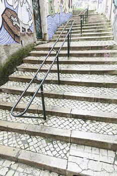 Stairs in Alfama district, Lisbon, detail of a old sclera in a typical neighborhood