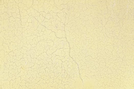 Background of old yellow painted wall detail of a damaged wall and abandoned
