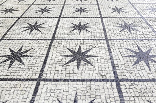 Typical stone floor Lisbon, detail of a typical floor with shapes and drawings, art Portugal, tourism