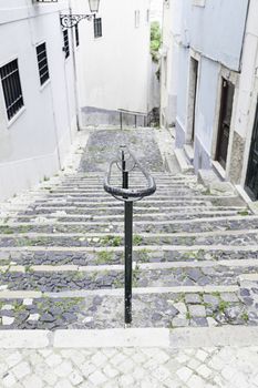 Old stone stairs in Lisbon, detail of stairs in an old street in an old neighborhood in Portugal