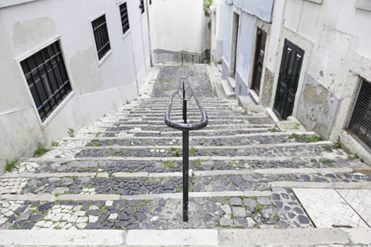 Old stone stairs in Lisbon, detail of stairs in an old street in an old neighborhood in Portugal