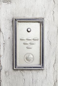 Old intercom in a house, detail of a electric apparatus in the facade of a building