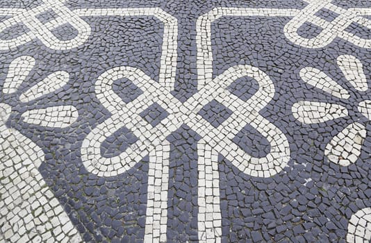 Typical stone floor Lisbon, detail of a typical floor with shapes and drawings, art Portugal, tourism