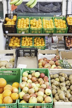 Fresh fruit in a market, detail of an old store with fruit in a market town
