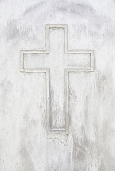 Old rusty metal cross, detail of an old cross on a metal wall, cemetery